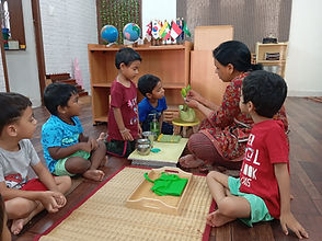 A child working at a table with Montessori materials