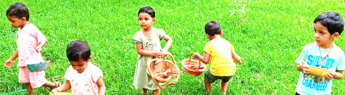 Children exploring outdoors at Dheeksha Montessori
