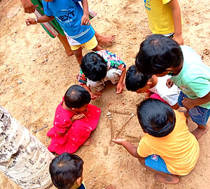 Children working with practical life activities